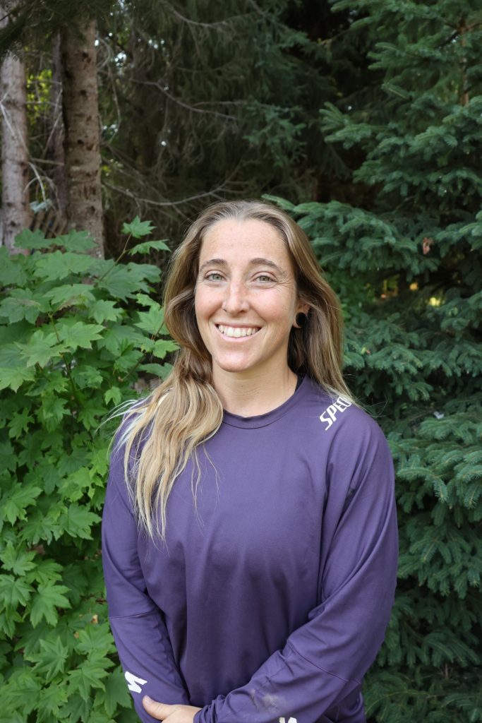 Chelsea Kimball smiling in a purple shirt